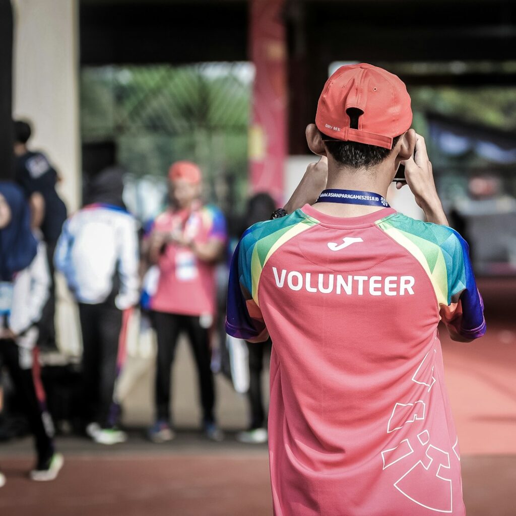 person standing wearing red shirt